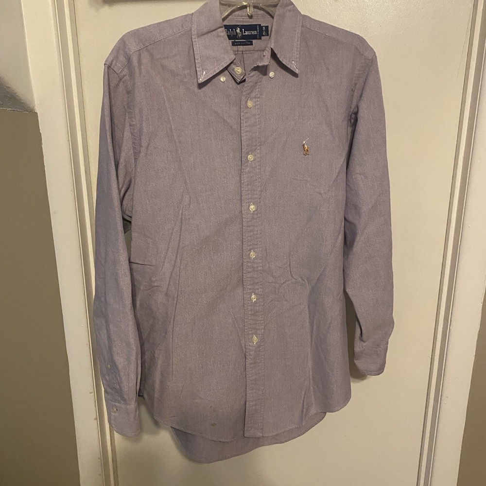 Light purple polo putting up dress shirt